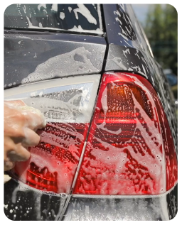 man-washing-his-luxury-yellow-car-under-high-press-TYJVQEK